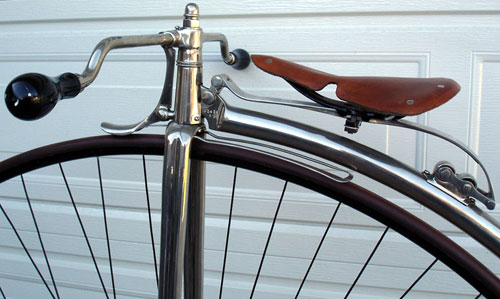 The seat spring pivots on rubber bushings