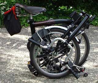 Undo the wingnut and let the bars fold