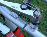 Turn the screw to fine-tune centering