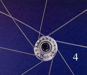 Twist the hub so that the spoke is parallel